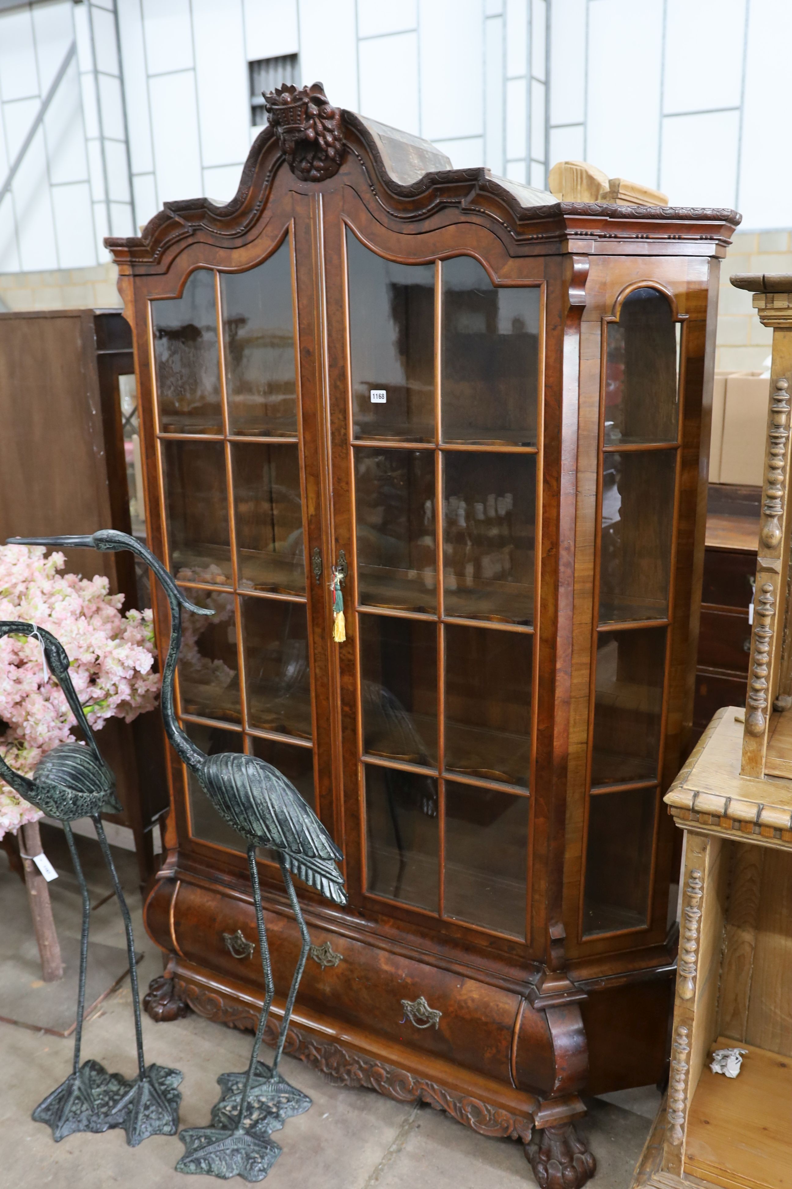 A 19th century Dutch glazed walnut two door vitrine. W 150cm, D 38cm, H 212cm.